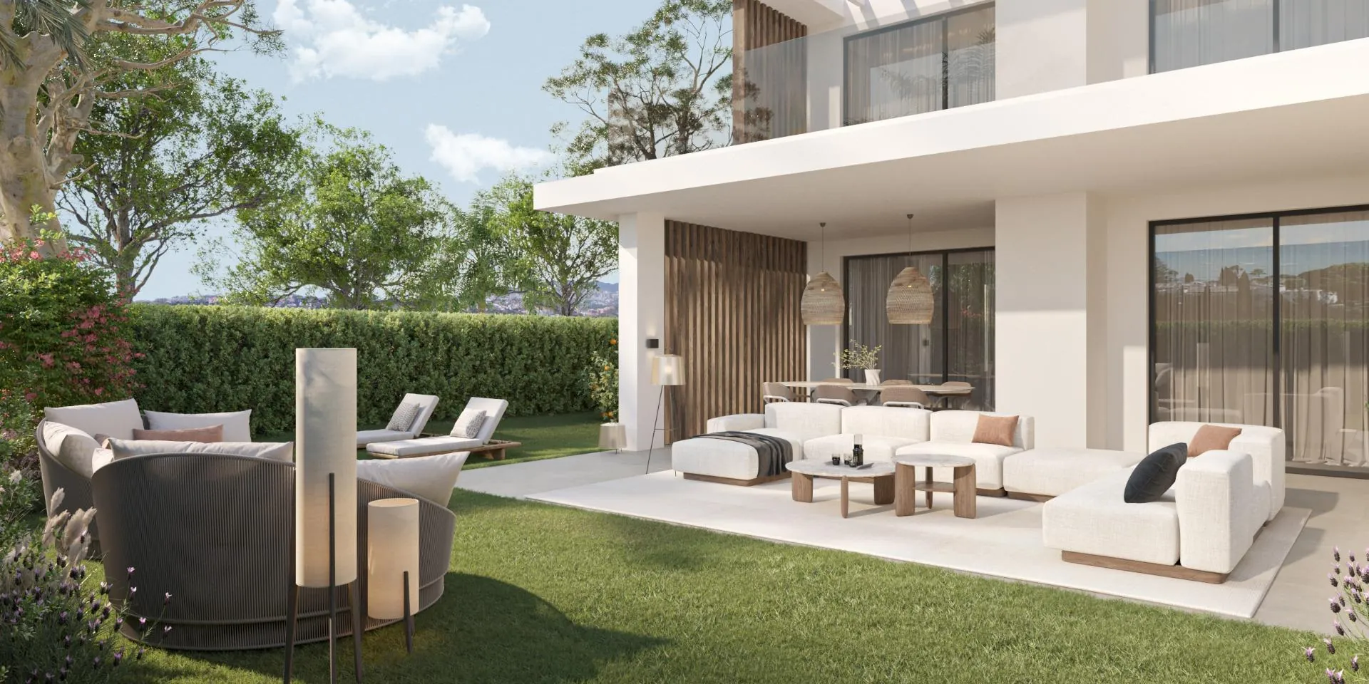 Terraza con salón exterior y jardín del apartamento de Sotoserena, Estepona